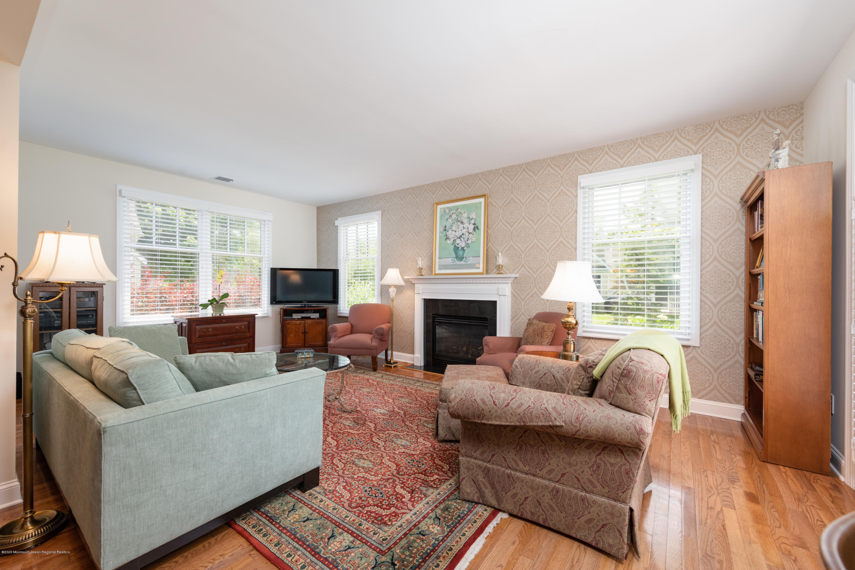 10 Adams Way Shrewsbury, NJ 07702 - Photo 5 of 19 a living room with furniture and a fireplace
