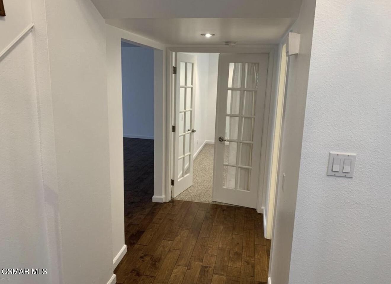 924 Thistlegate Road Oak Park, CA 91377 - Photo 7 of 20 a view of a hallway with wooden floor and closet