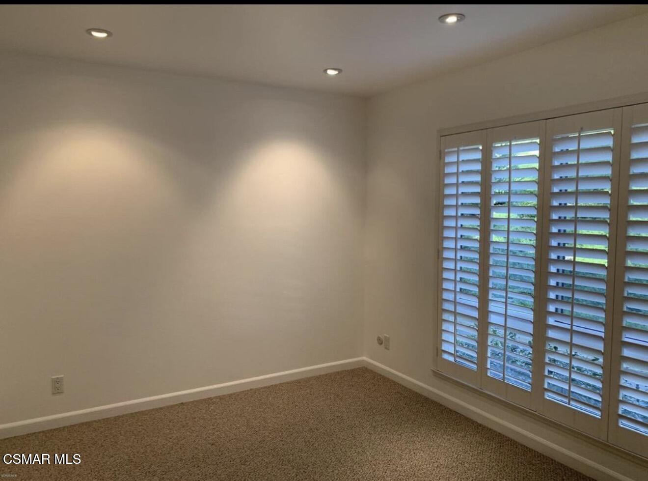 924 Thistlegate Road Oak Park, CA 91377 - Photo 9 of 20 a view of an empty room with a window