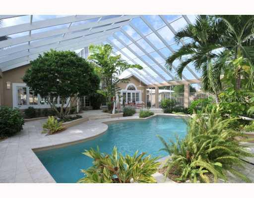 8150 Manasota Key Road Englewood, FL 34223 - Photo 1 of 1 Exterior Front - Enter through the Tropical pool area.