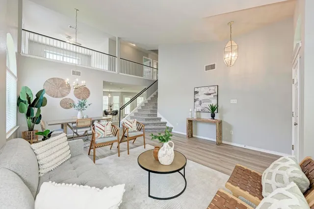 a living room with furniture and a table