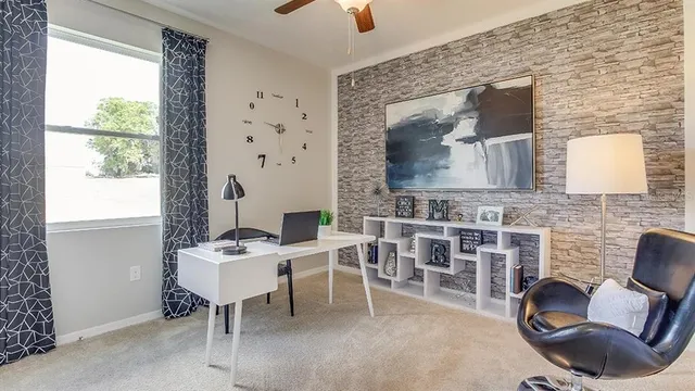 a living room with furniture a dining table and a fireplace