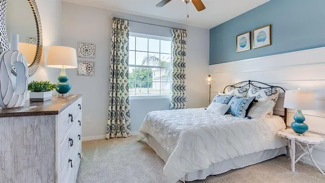 a bedroom with a bed and window