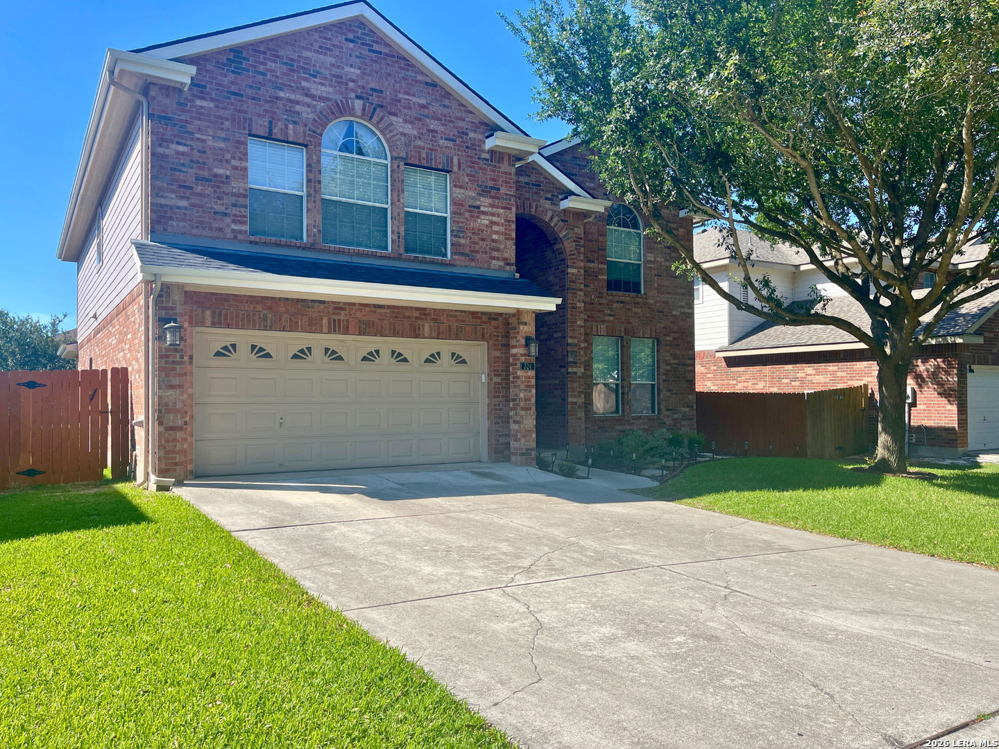 324 Willow Loop Cibolo, TX 78108 - Photo 1 of 20 a front view of a house with a yard and garage