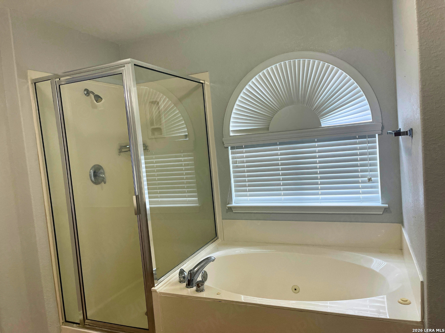 324 Willow Loop Cibolo, TX 78108 - Photo 13 of 20 a bathroom with a tub and a shower