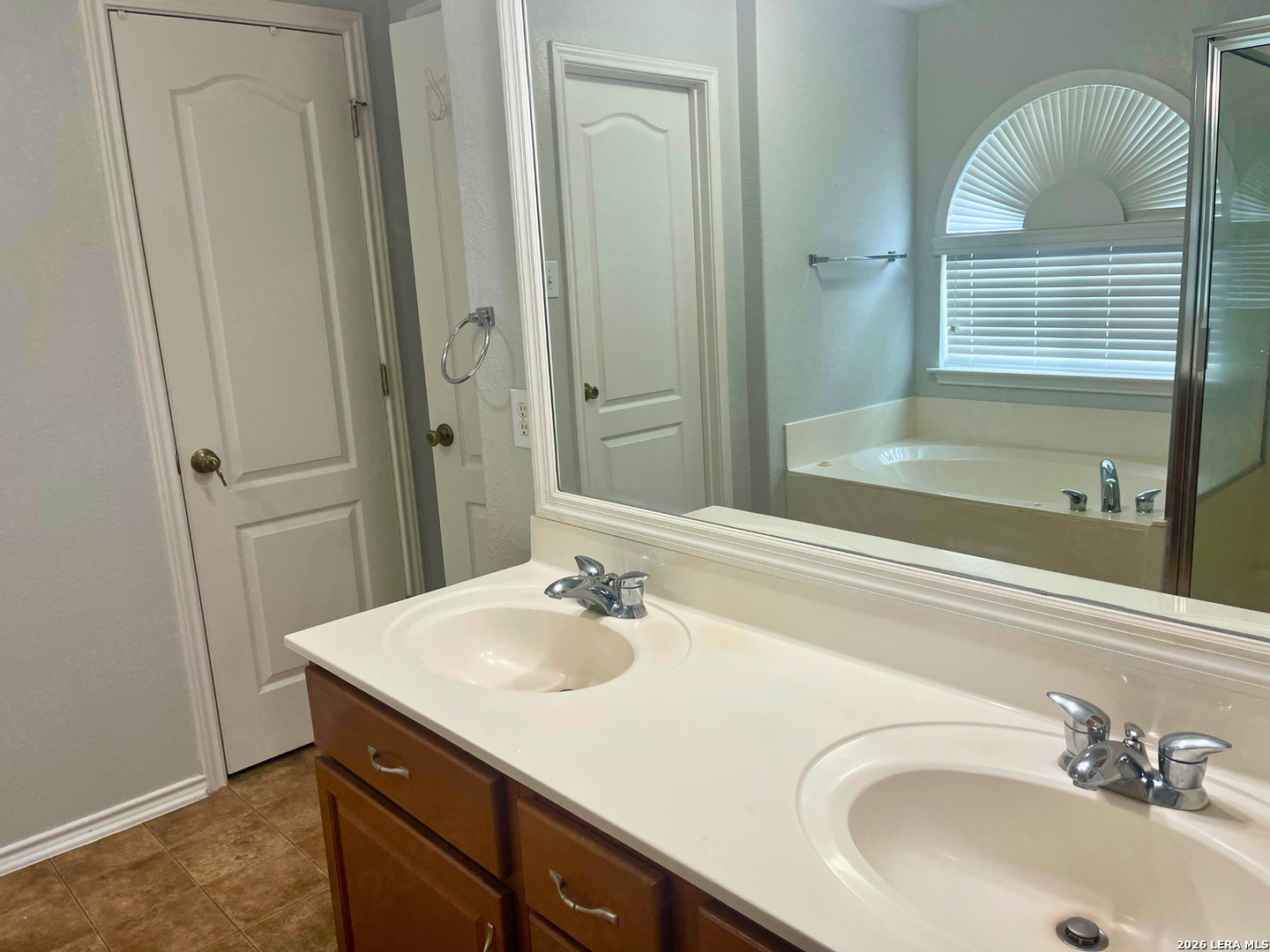324 Willow Loop Cibolo, TX 78108 - Photo 14 of 20 a bathroom with a sink and a mirror