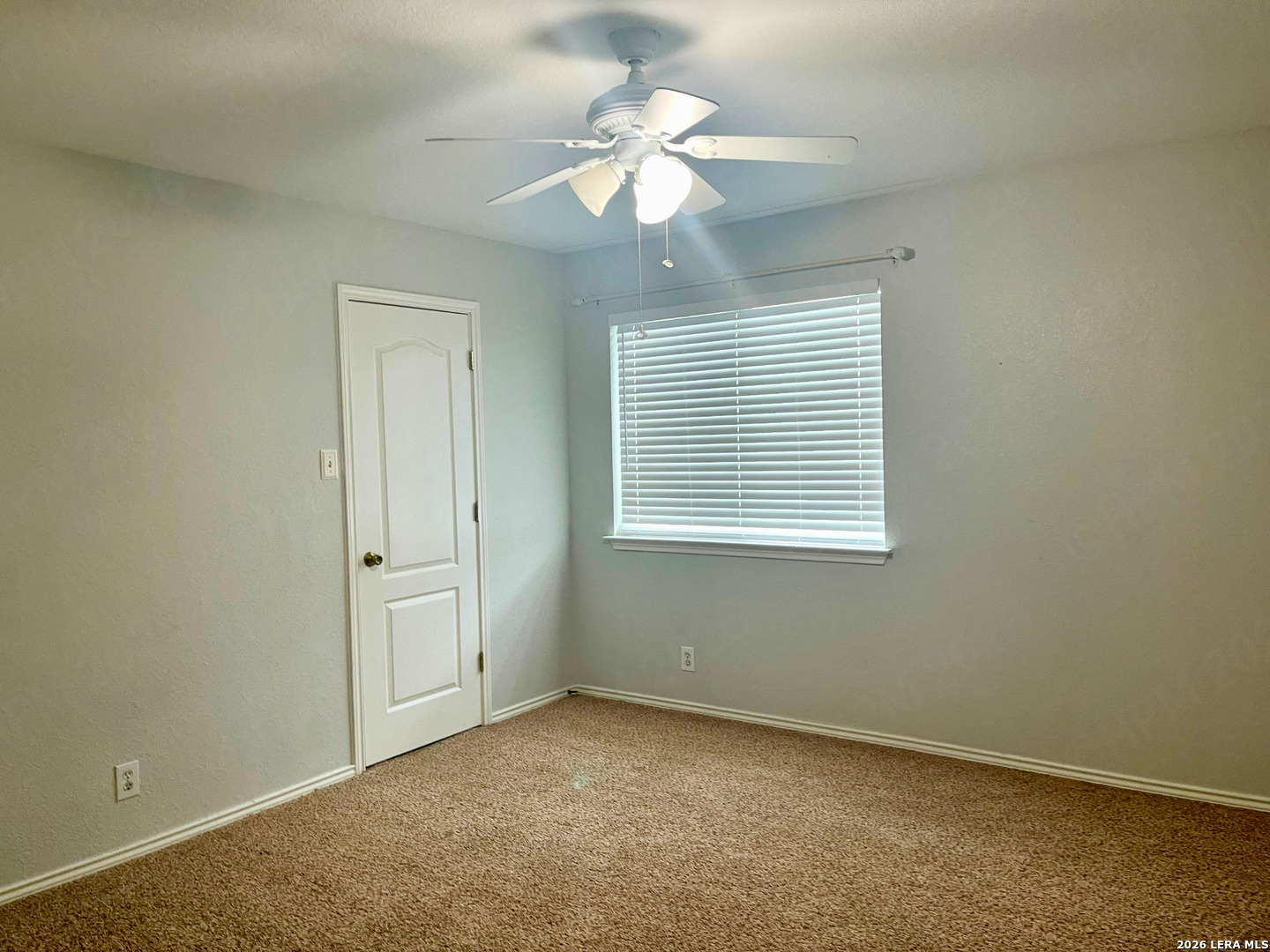 324 Willow Loop Cibolo, TX 78108 - Photo 17 of 20 an empty room with windows and fan