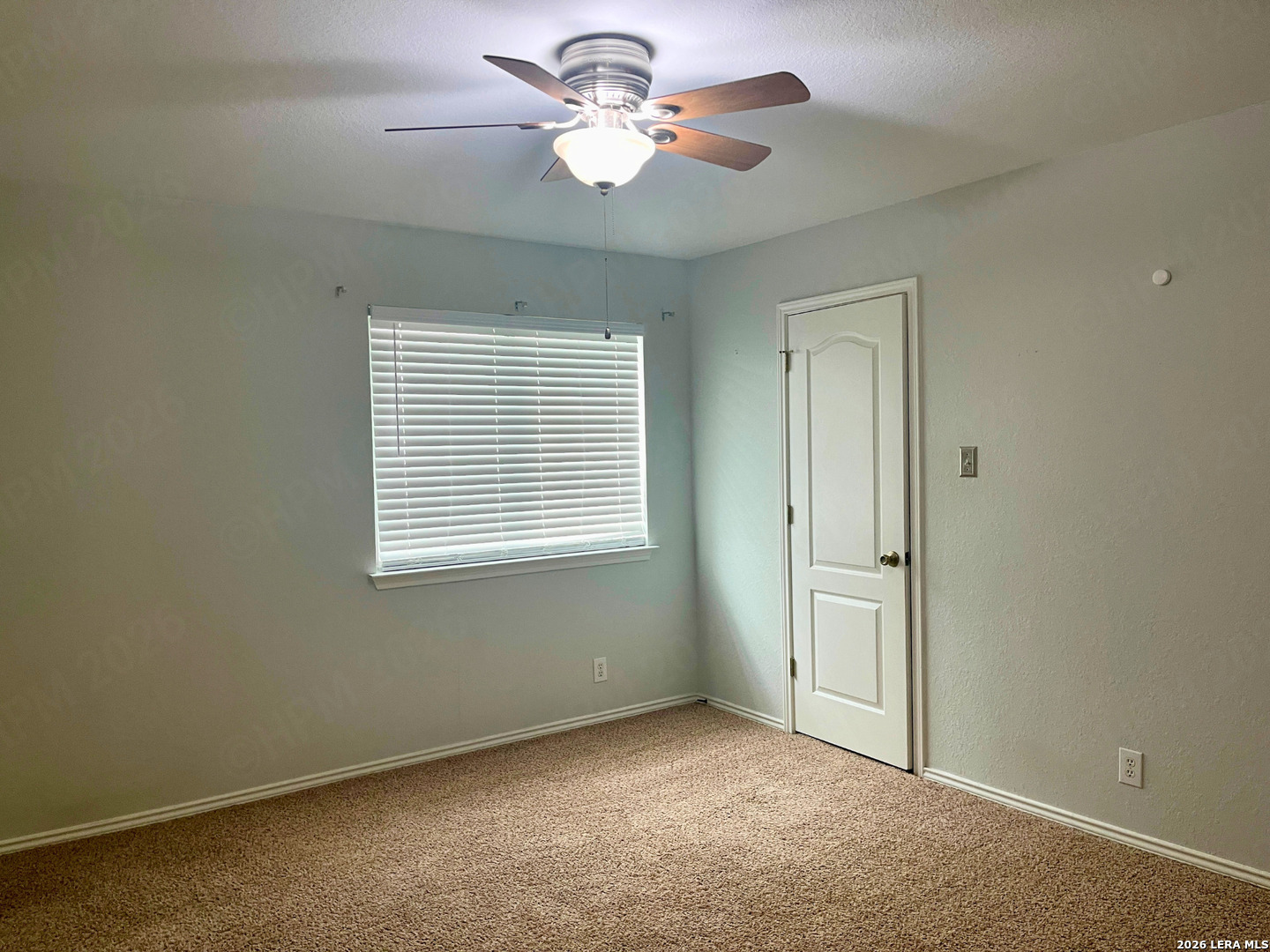 324 Willow Loop Cibolo, TX 78108 - Photo 18 of 20 an empty room with windows and fan