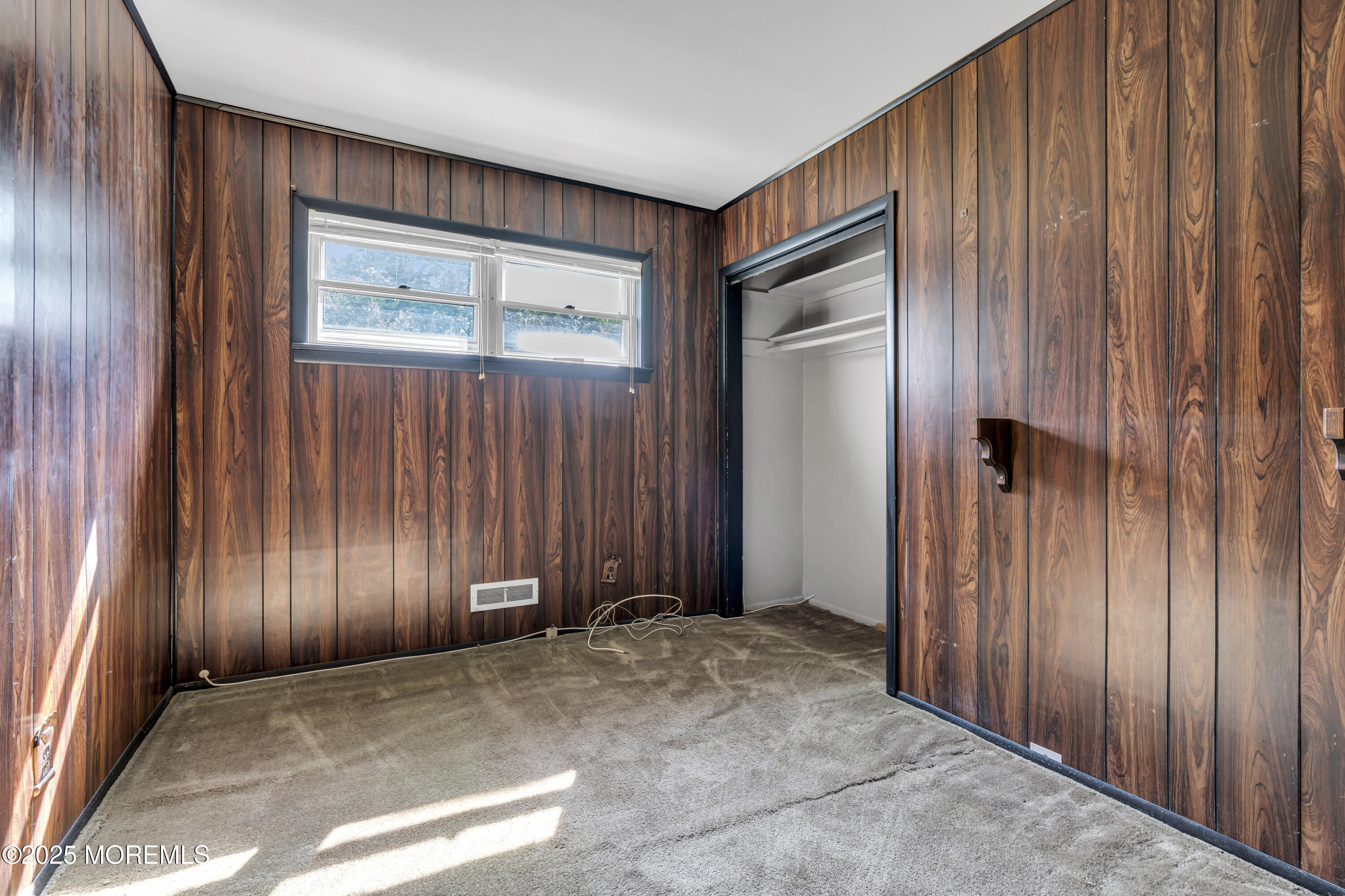 36 Parkview Drive Hazlet, NJ 07730 - Photo 17 of 25 an empty room with wooden door and windows