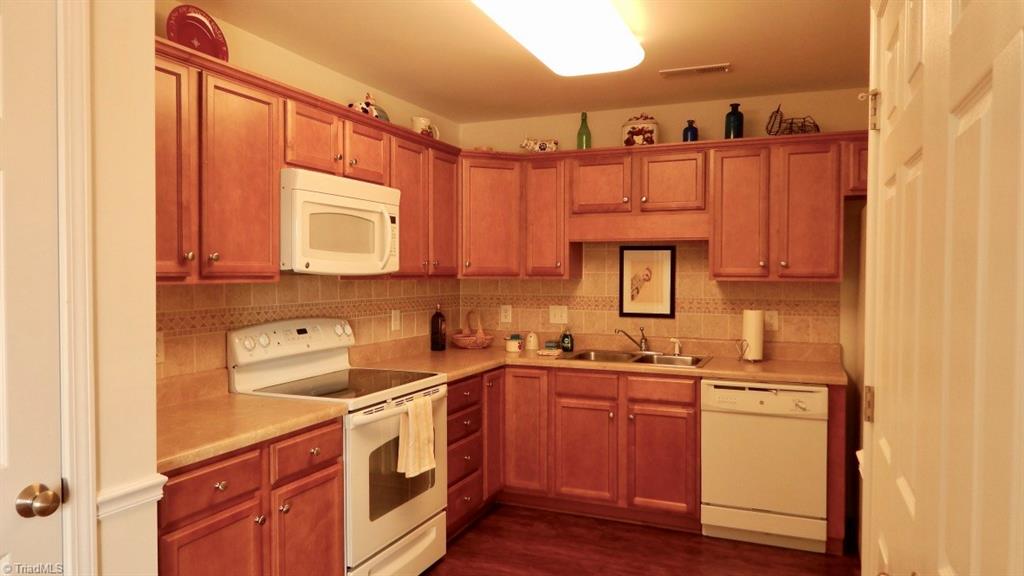 115 Brae Ridge Lane King, NC 27021 - Photo 4 of 14 Convenient kitchen. Free standing range oven, microwave, dishwasher, and refrigerator.