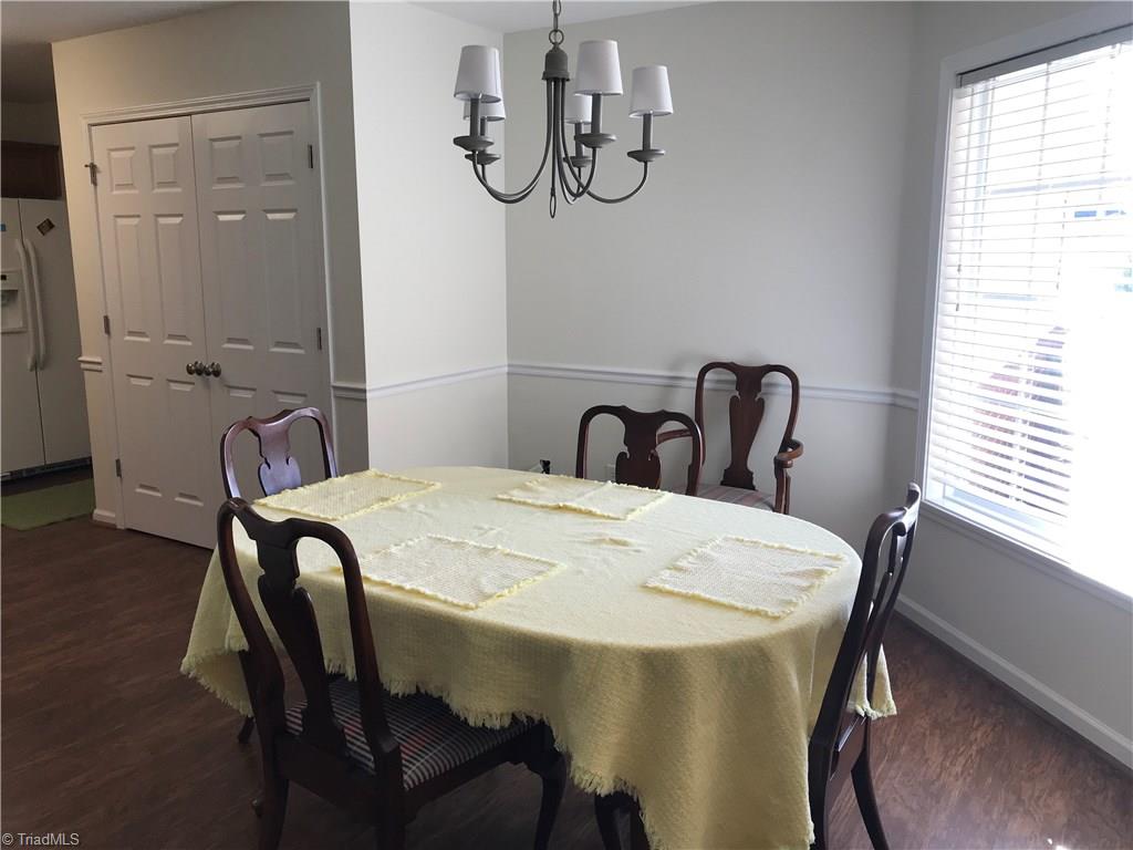 115 Brae Ridge Lane King, NC 27021 - Photo 6 of 14 Wood floor in dining area.