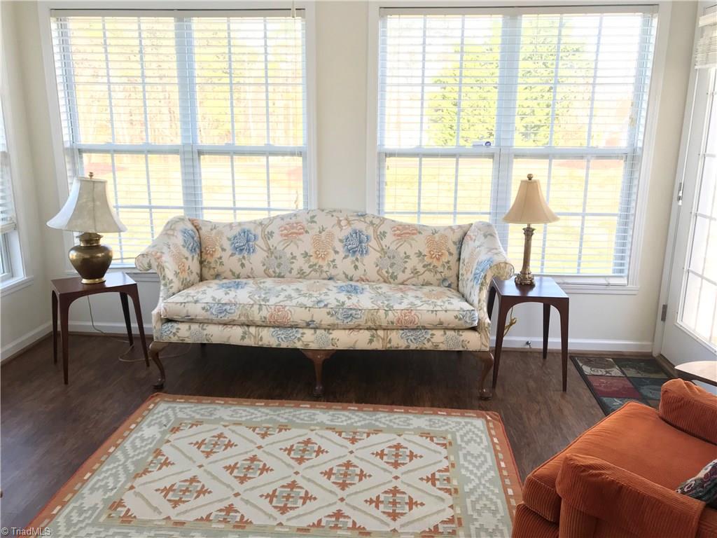 115 Brae Ridge Lane King, NC 27021 - Photo 7 of 14 This townhome has a sunroom with wood flooring.
