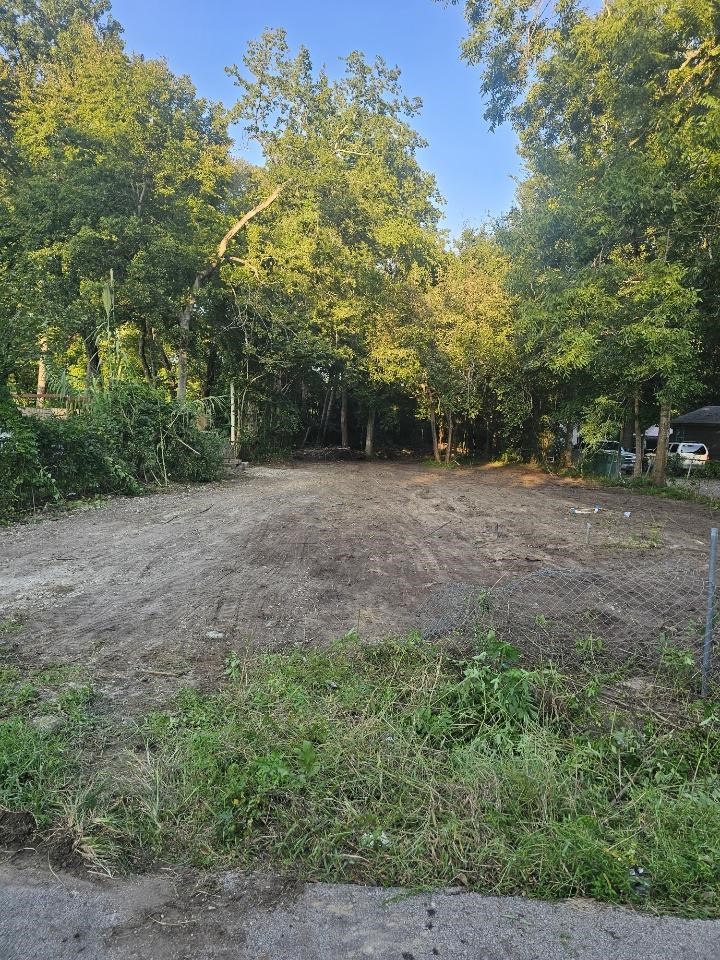 400 South 13th Street Conroe, TX 77301 - Photo 2 of 4 a view of a field with trees in the background