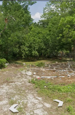 a view of a yard with a bench