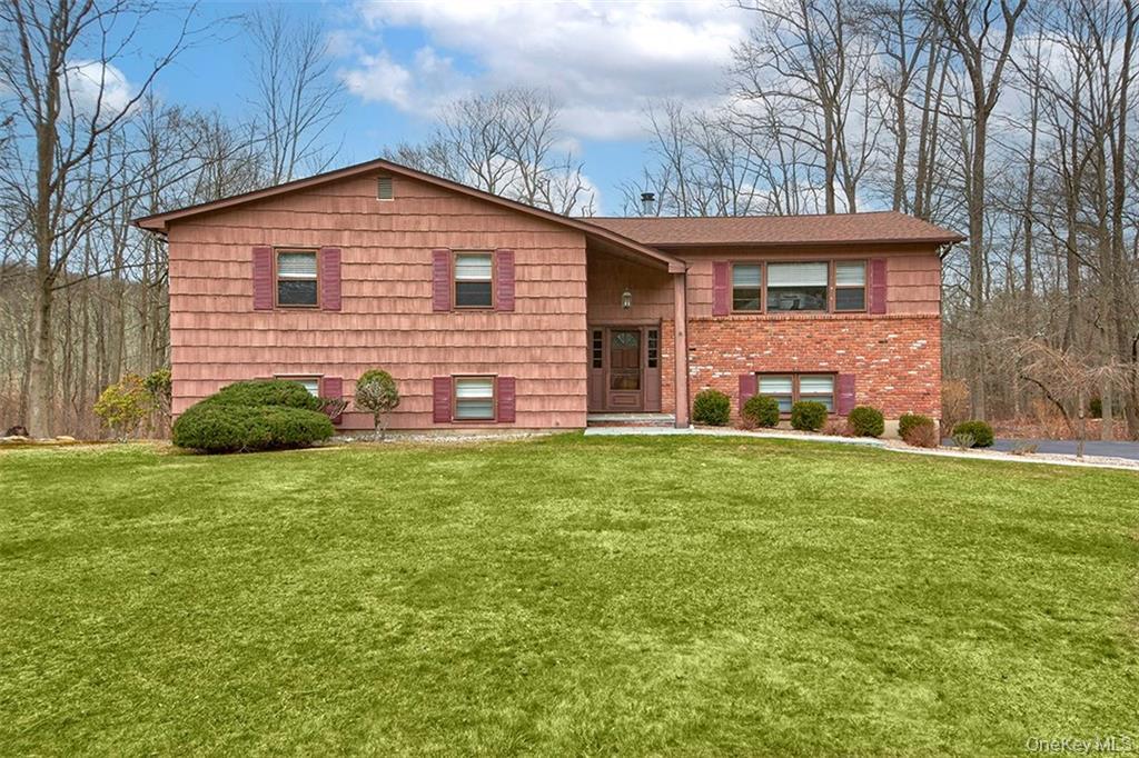 74 Edgewood Road Ossining, NY 10562 - Photo 1 of 23 a view of a yard in front of a house with large trees