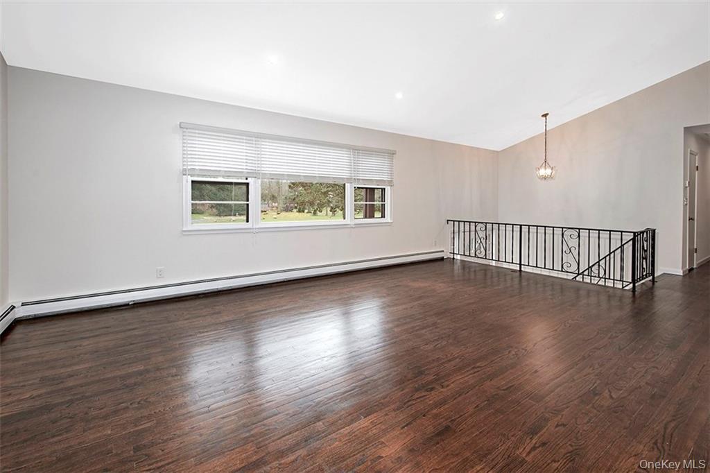 74 Edgewood Road Ossining, NY 10562 - Photo 5 of 23 a view of an empty room with wooden floor and a window