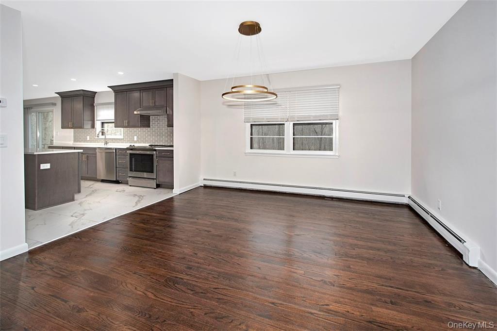 74 Edgewood Road Ossining, NY 10562 - Photo 7 of 23 a view of kitchen with granite countertop cabinets and wooden floor