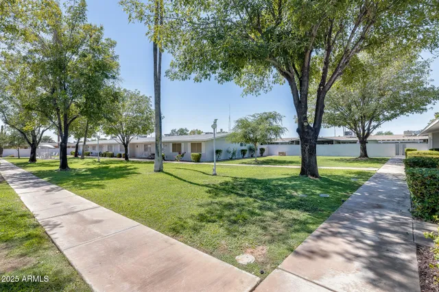 a view of a big room with closet and windows