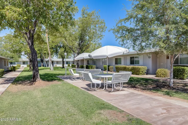 a kitchen with a refrigerator and a sink