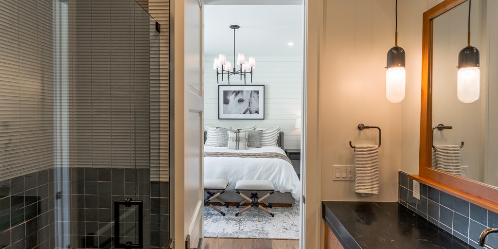 811 Boot Ranch Circle Fredericksburg, TX 78624 - Photo 14 of 34 a en suite bathroom with a sink and a mirror