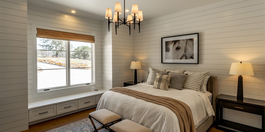 811 Boot Ranch Circle Fredericksburg, TX 78624 - Photo 15 of 34 a bedroom with a bed and a window