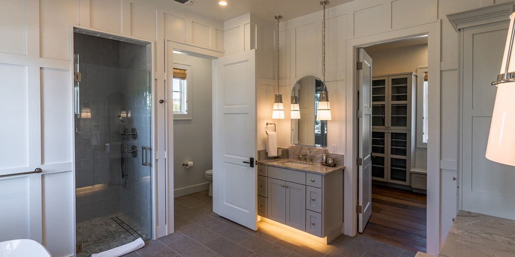 811 Boot Ranch Circle Fredericksburg, TX 78624 - Photo 17 of 34 a bathroom with a granite countertop sink mirror and shower