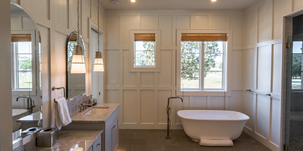 811 Boot Ranch Circle Fredericksburg, TX 78624 - Photo 18 of 34 a bathroom with a tub sink and mirror