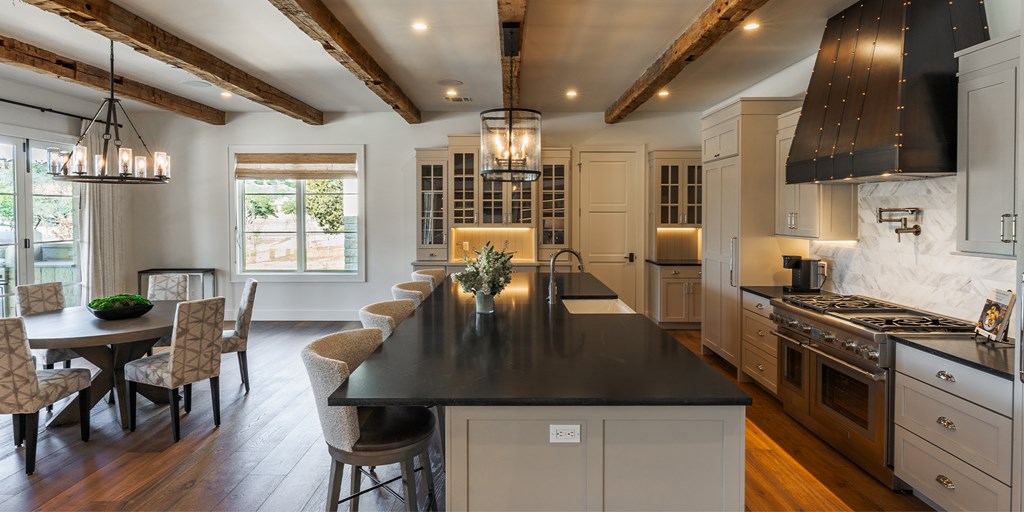 811 Boot Ranch Circle Fredericksburg, TX 78624 - Photo 22 of 34 a kitchen with stove a table and chairs