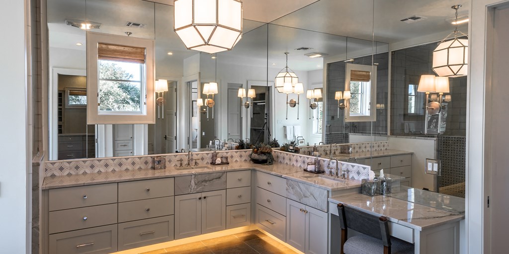811 Boot Ranch Circle Fredericksburg, TX 78624 - Photo 27 of 34 a spacious bathroom with double vanity a mirror a vanity and a shower