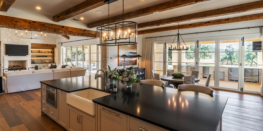 811 Boot Ranch Circle Fredericksburg, TX 78624 - Photo 6 of 34 a living room with furniture floor to ceiling window and wooden floor