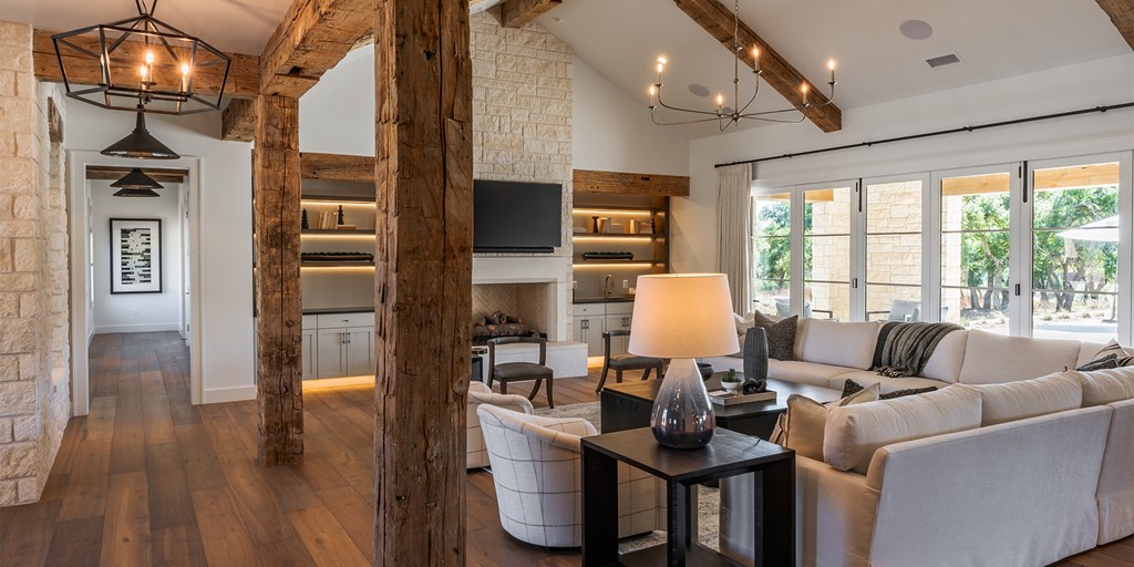 811 Boot Ranch Circle Fredericksburg, TX 78624 - Photo 10 of 34 a living room with furniture a flat screen tv and a floor to ceiling window