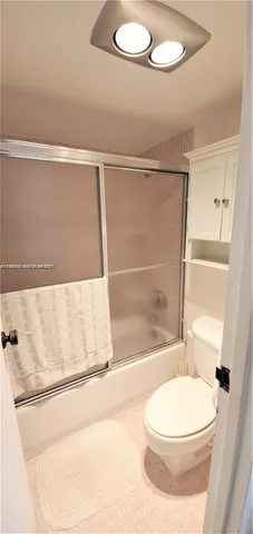 a bedroom with two beds and a dresser