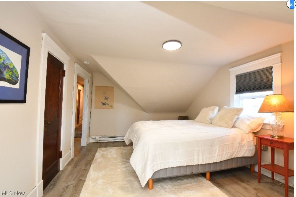 2135 Renrock Road Cleveland, OH 44118 - Photo 41 of 44 Bedroom with lofted ceiling and light hardwood / wood-style floors