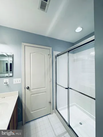 a bathroom with a tub and a sink