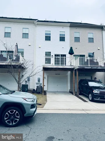 a car parked in front of a house