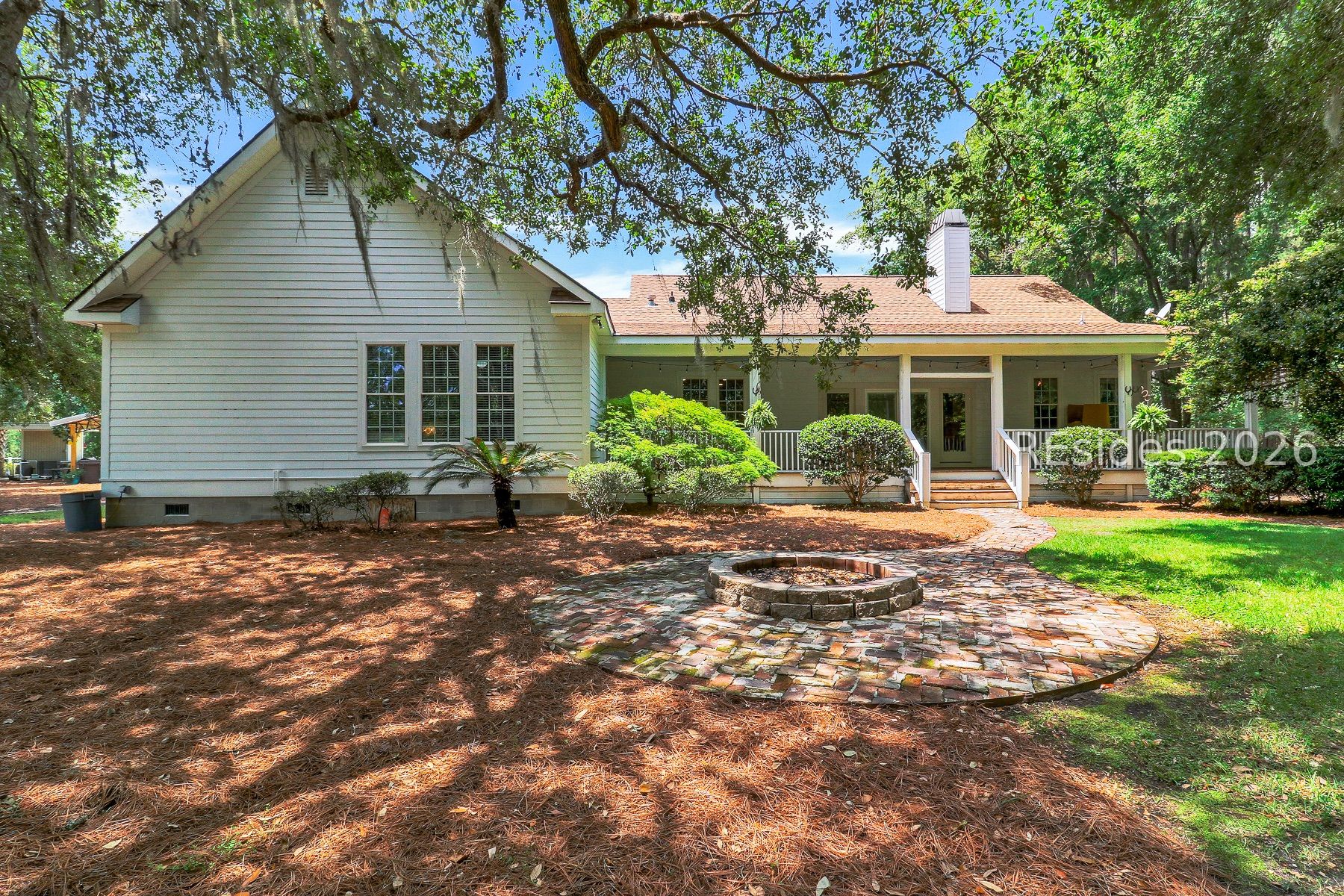 7724 Bees Creek Road Ridgeland, SC 29936 - Photo 2 of 82 Back of Home with Beautiful Live Oaks and Fire Pit