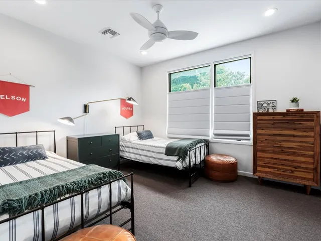 a bedroom with a bed and a dresser