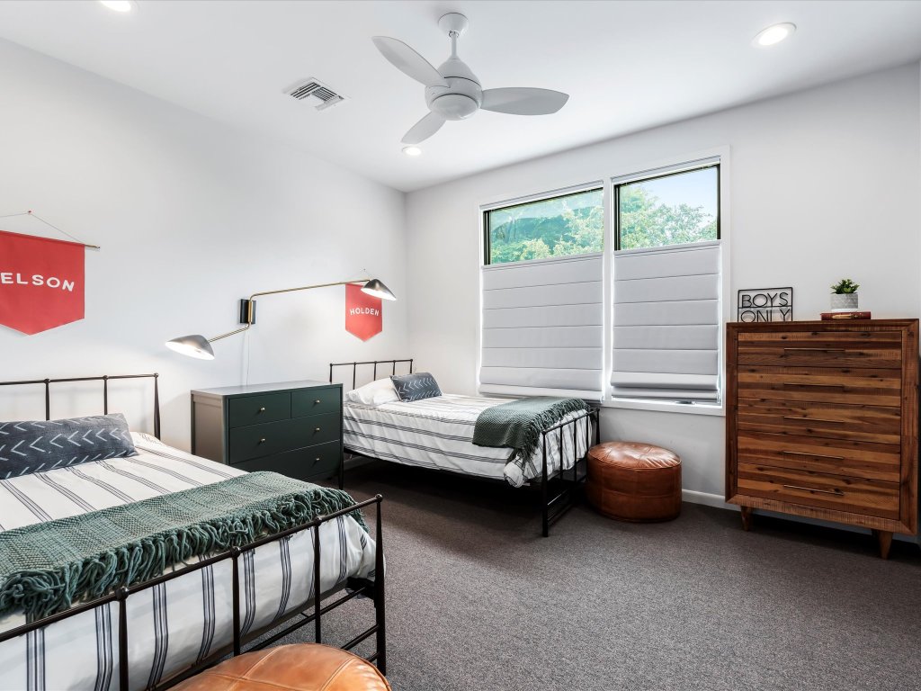 1703 Dexter Street Austin, TX 78704 - Photo 30 of 38 a bedroom with a bed and a dresser