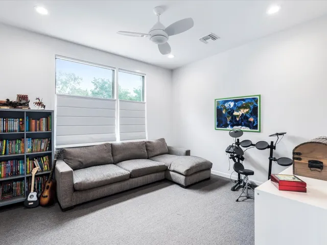 a living room with furniture workspace and a window