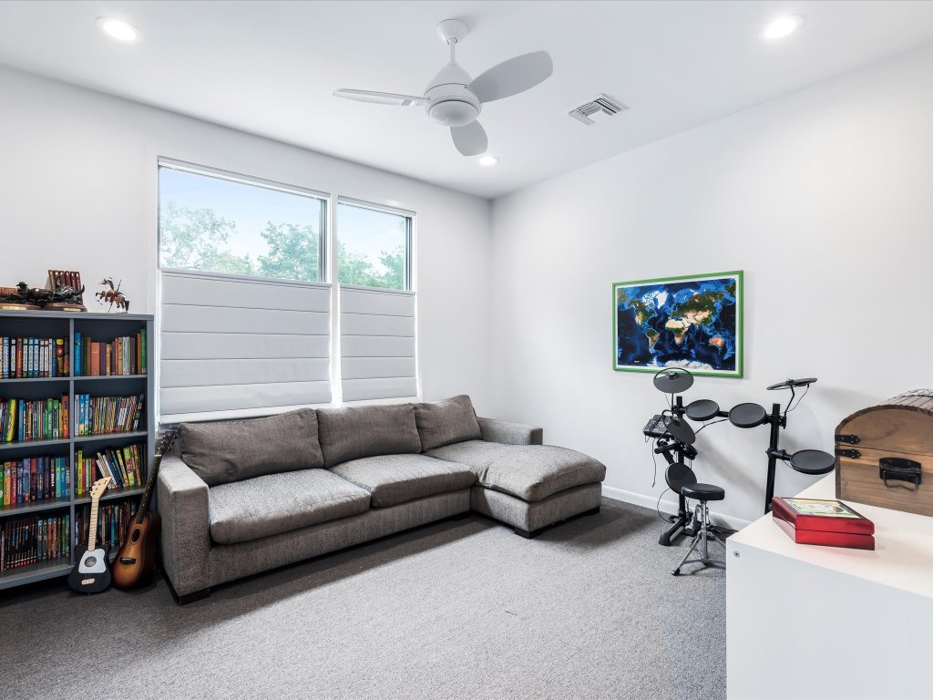 1703 Dexter Street Austin, TX 78704 - Photo 32 of 38 a living room with furniture workspace and a window