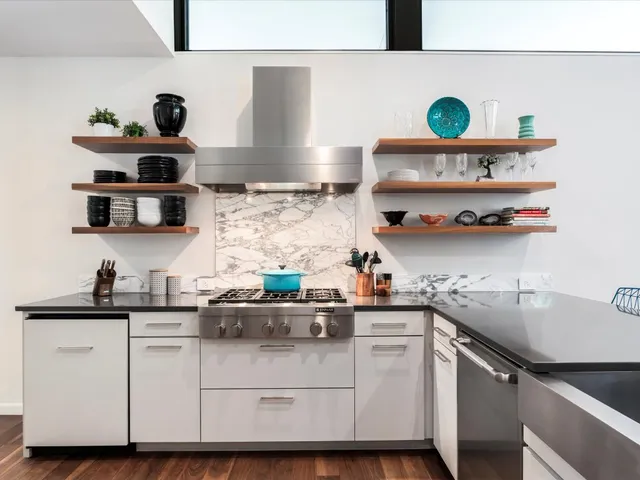 a kitchen with white cabinets and a sink