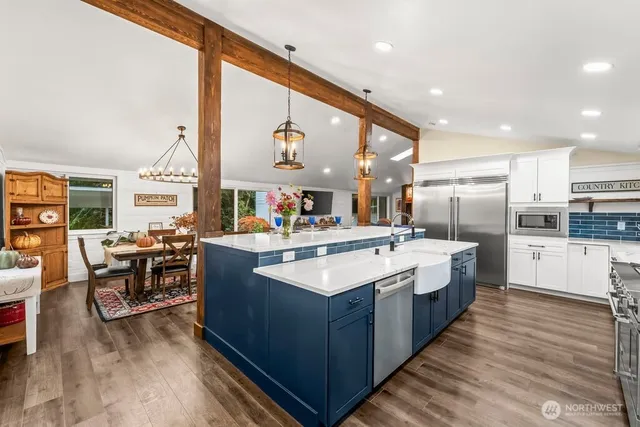 a kitchen with a stove and cabinets