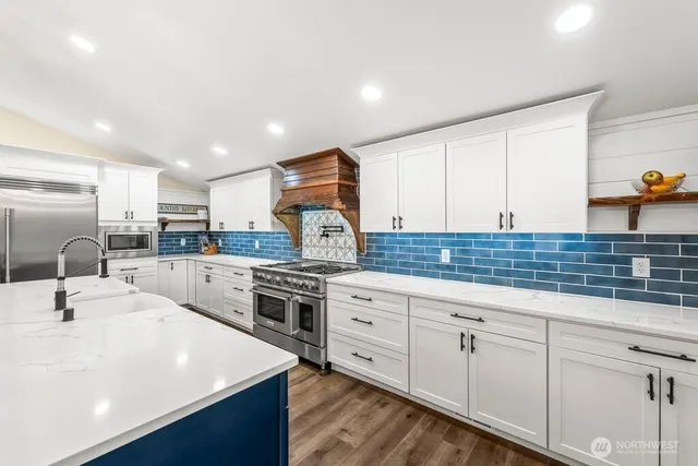 a bathroom with a sink a toilet and tub