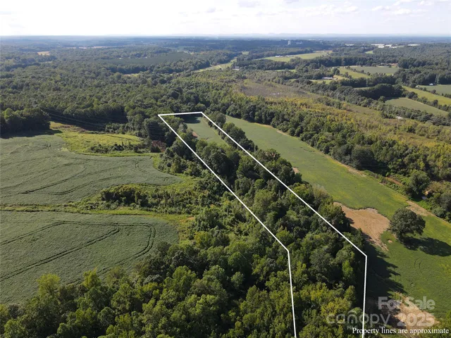 a view of a town with mountains in the background