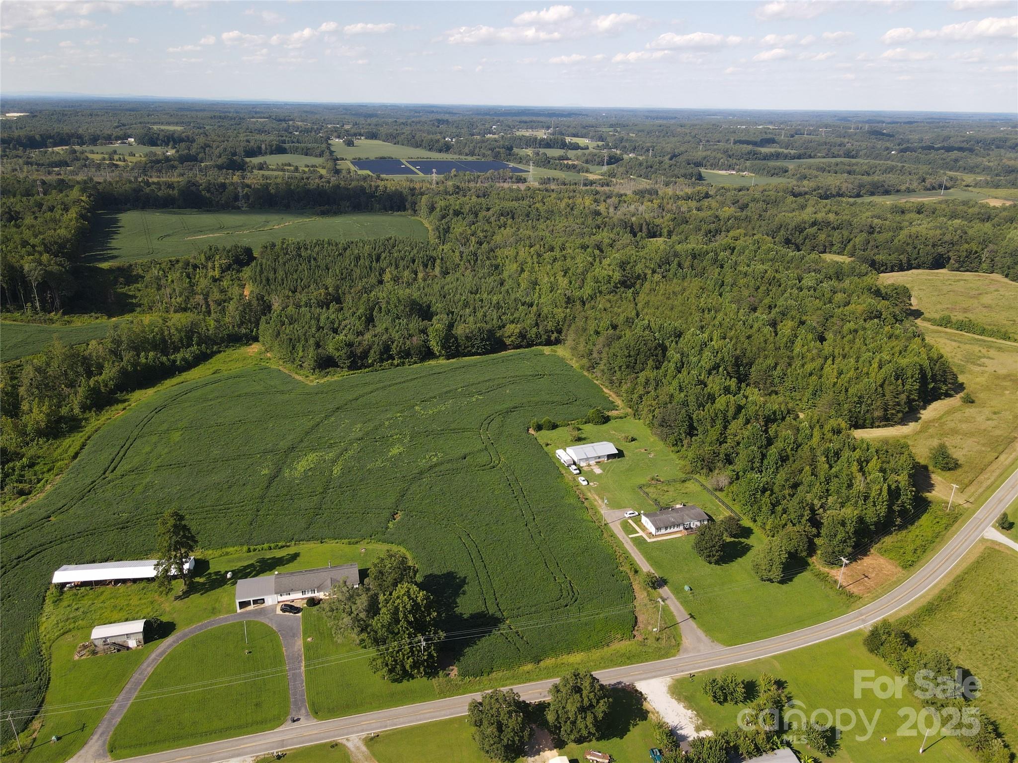 215 Rowan Road Cleveland, NC 27013 - Photo 6 of 29 an aerial view of a residential houses with outdoor space and trees