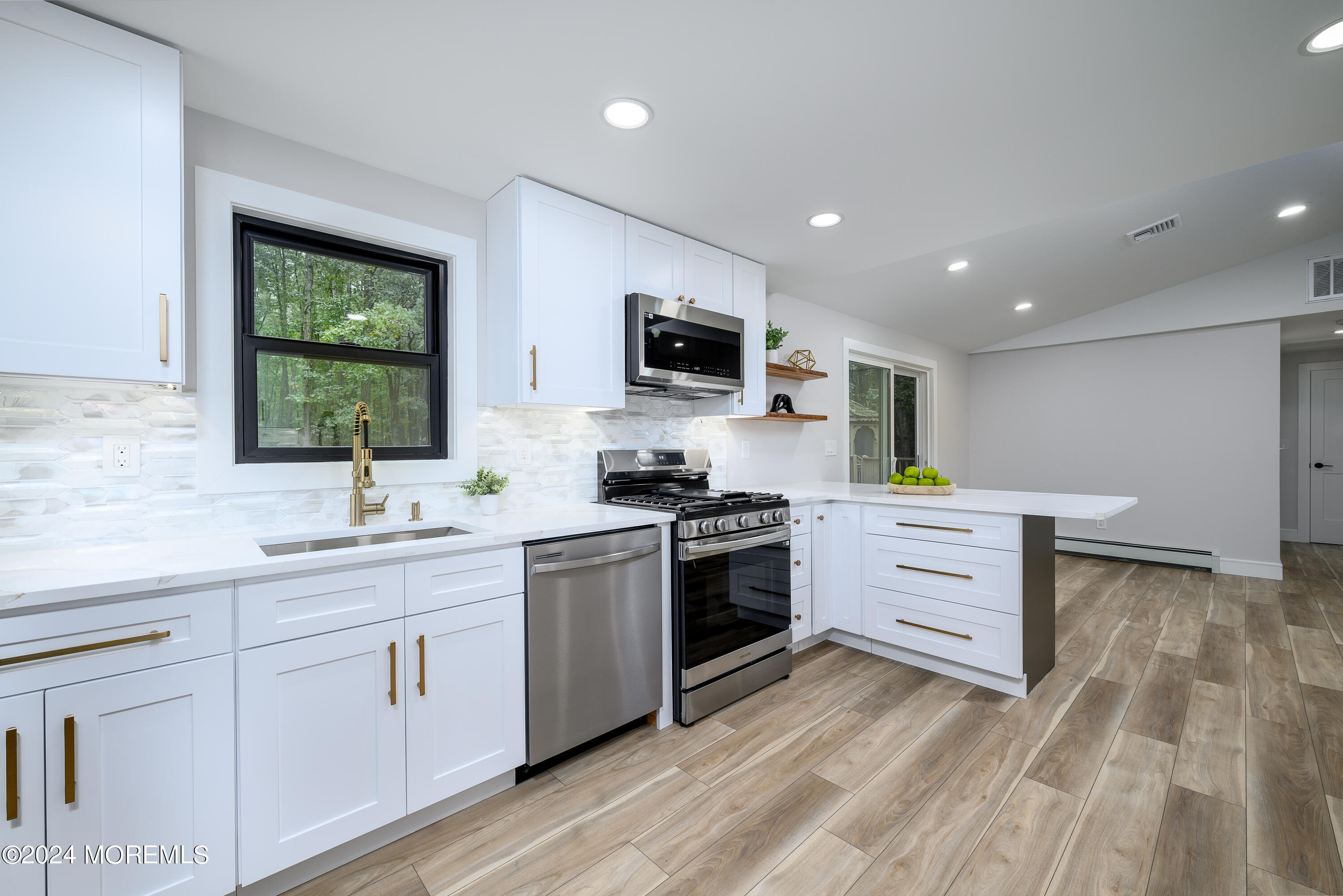 50 Old Turkey Swamp Road Freehold, NJ 07728 - Photo 8 of 23 a kitchen with a sink stove and cabinets