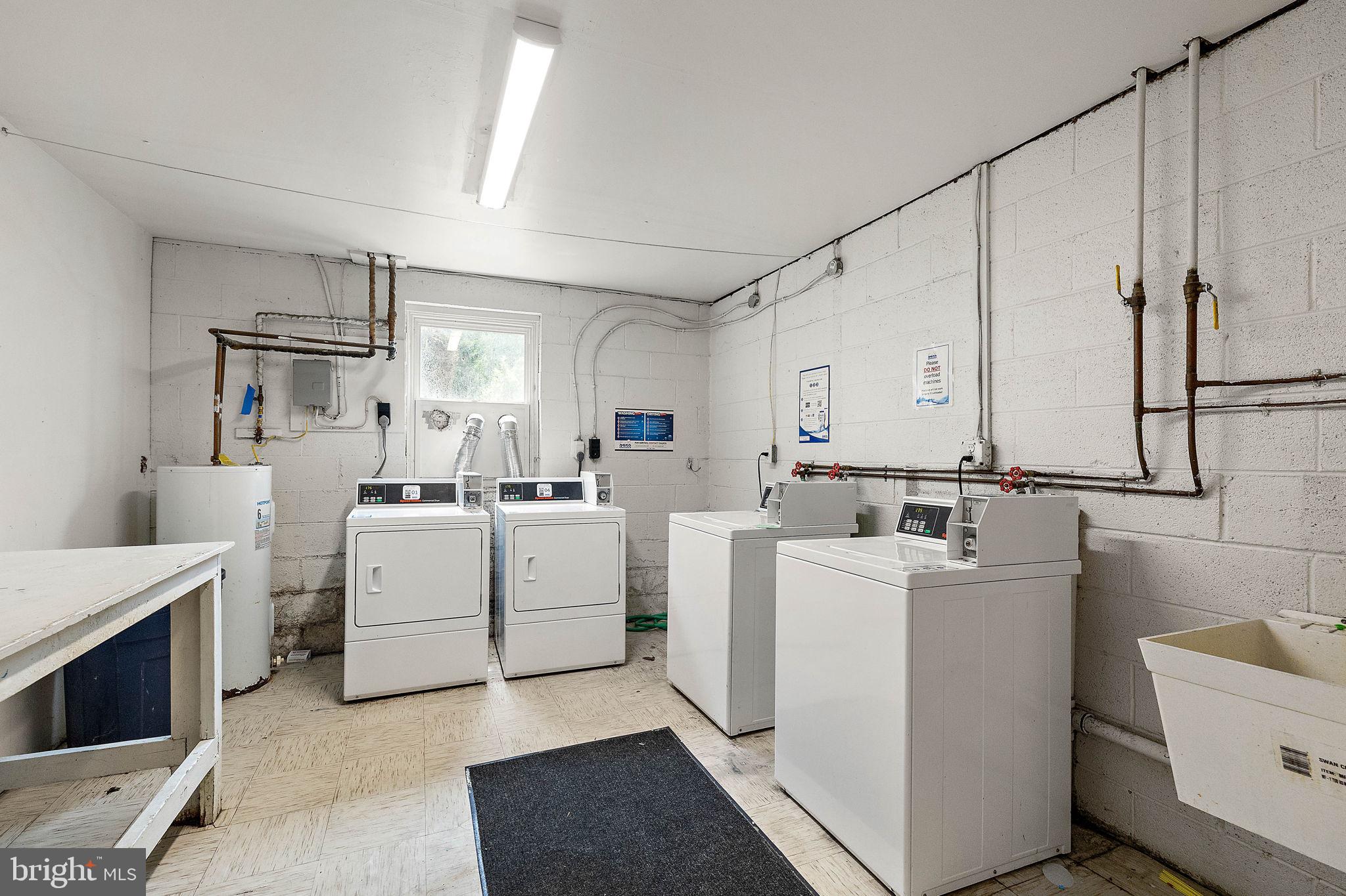 200 Brandywine Boulevard, Unit C7 Wilmington, DE 19803 - Photo 14 of 16 a kitchen with cabinets and washer dryer