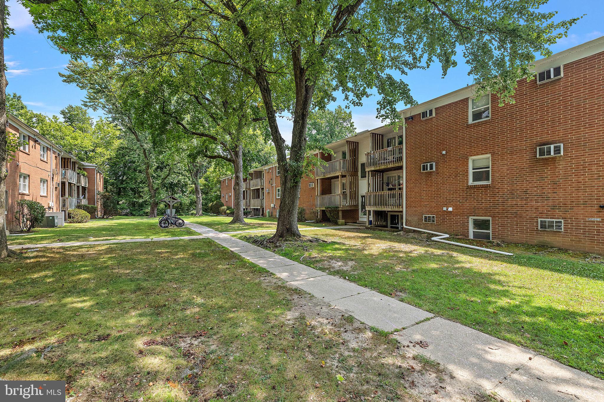 200 Brandywine Boulevard, Unit C7 Wilmington, DE 19803 - Photo 2 of 16 a view of a house with backyard and a tree