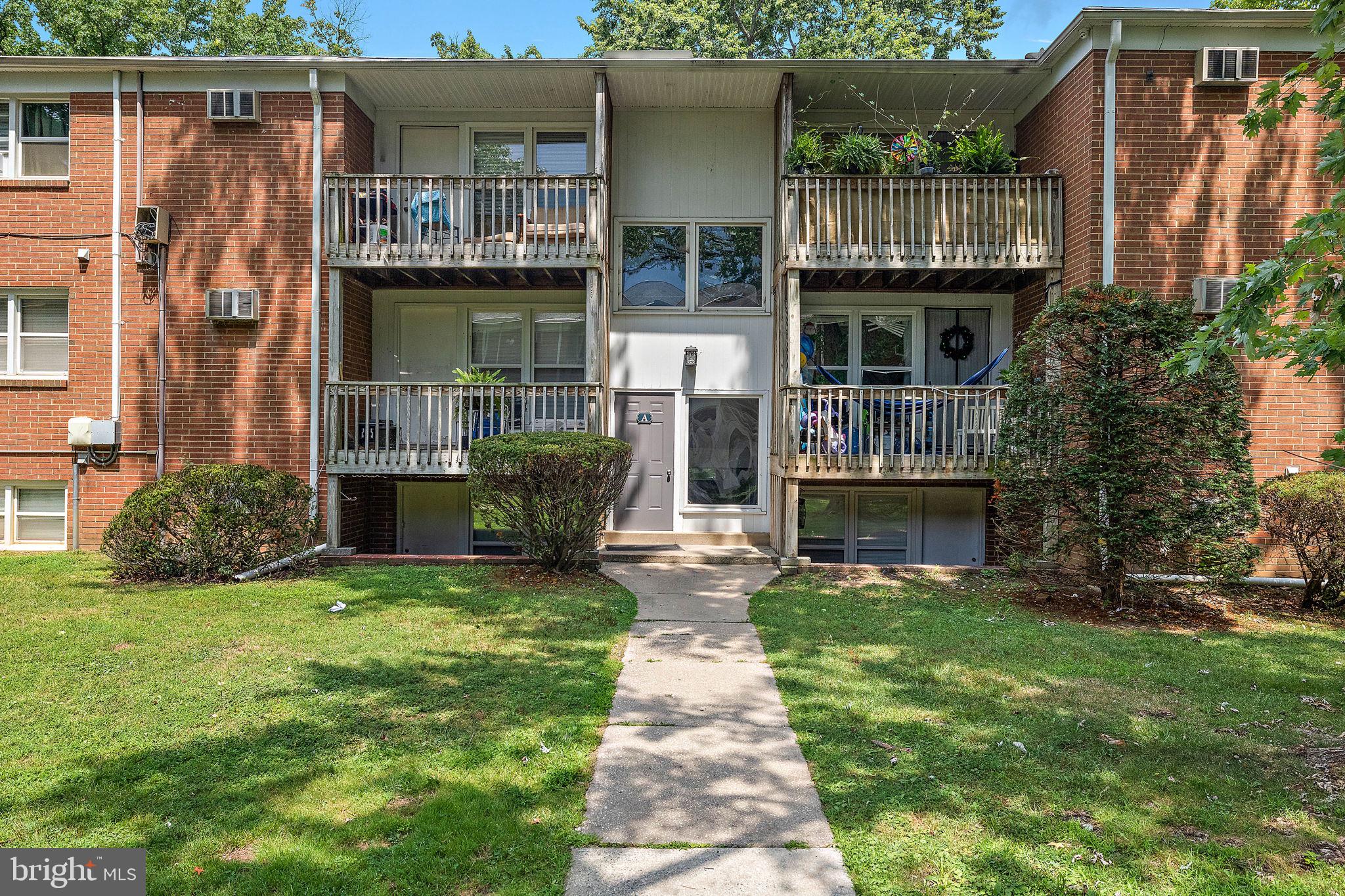 200 Brandywine Boulevard, Unit C7 Wilmington, DE 19803 - Photo 3 of 16 a front view of a house with garden