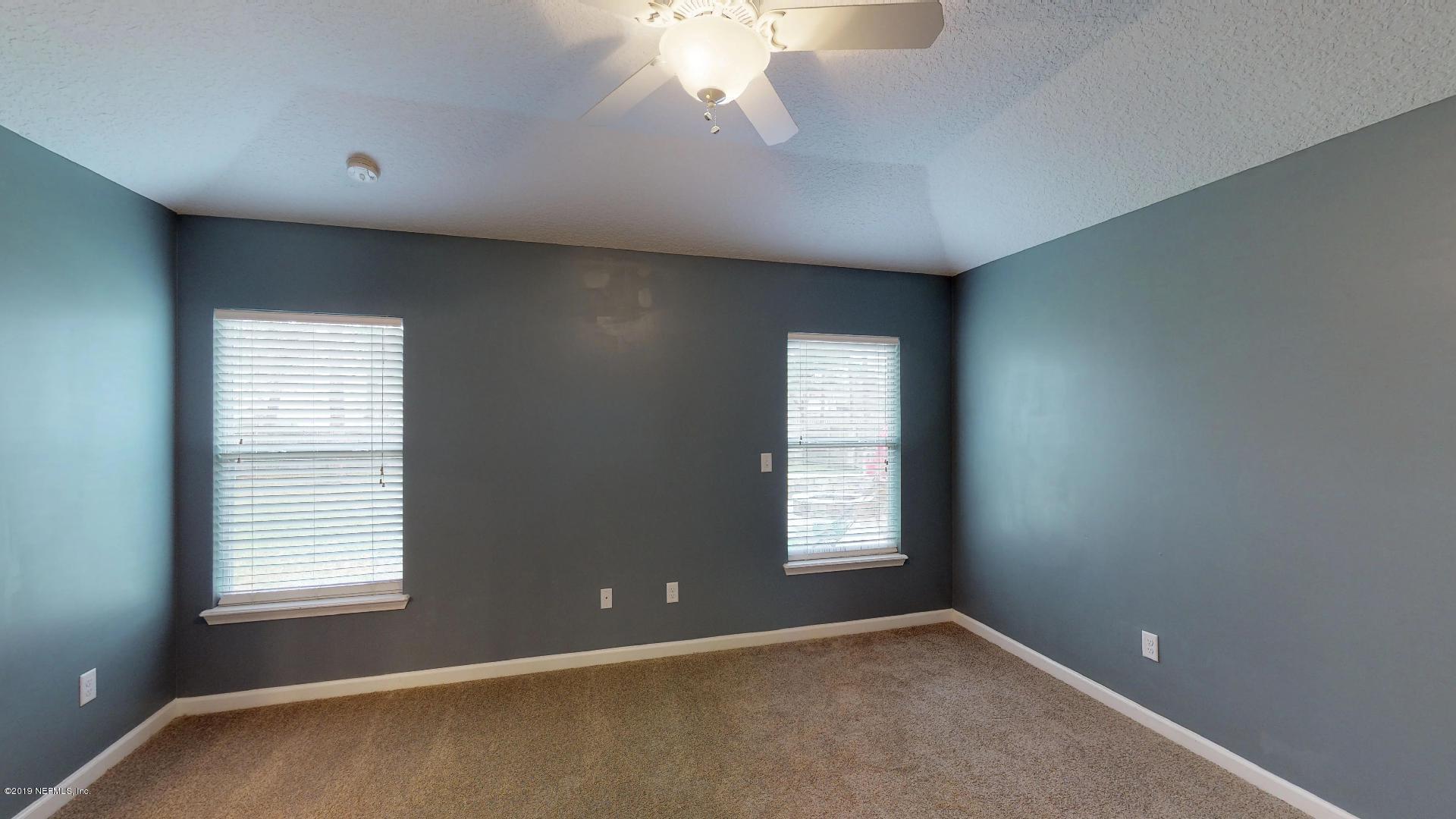1919 Derringer Road Jacksonville, FL 32225 - Photo 19 of 42 a view of an empty room with a window